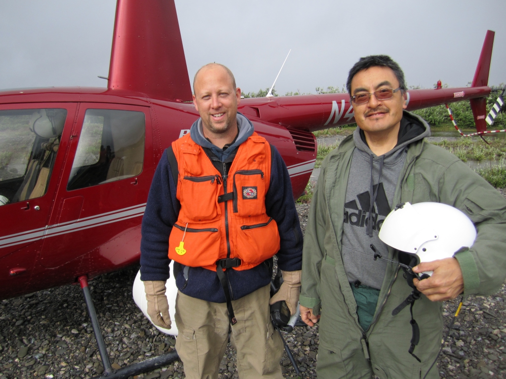 A researcher stands next to an elder from Kivalina in Raven Buff, Alaska. Credit: https://media.arcus.org/category/arctic-communities#cbp=12480